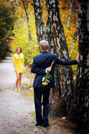 Young couple on date in an autumn parkの写真素材