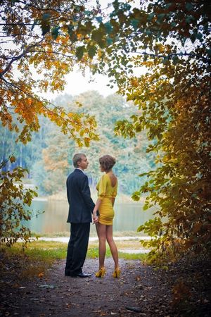 Young couple on date in an autumn parkの写真素材