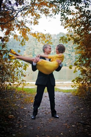 Young couple on date in an autumn parkの写真素材