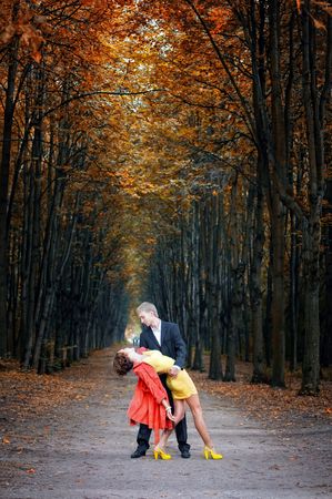 Young couple on date in an autumn parkの写真素材