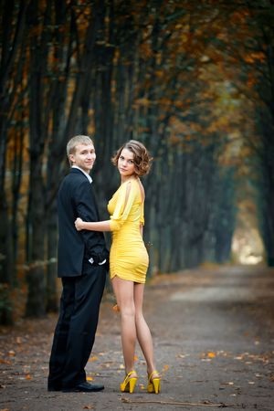 Young couple on date in an autumn parkの写真素材