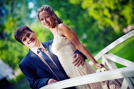 Portrait of newlyweds on a bridgeの写真素材