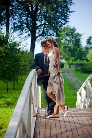 Portrait of newlyweds on a bridgeの写真素材