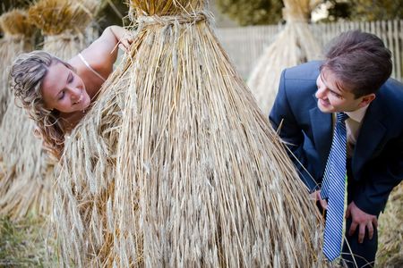 Portrait of newlyweds in hay stackの写真素材