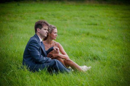 Portrait of newlyweds on green grassの写真素材