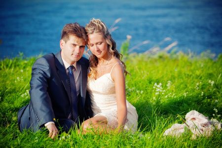 Portrait of newlyweds near a pondの写真素材