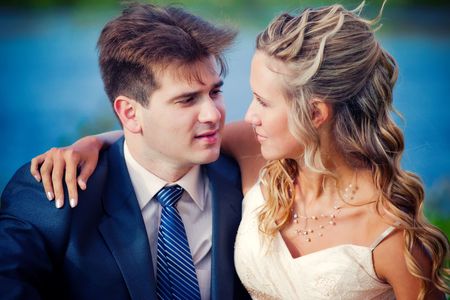 Portrait of newlyweds near a pondの写真素材