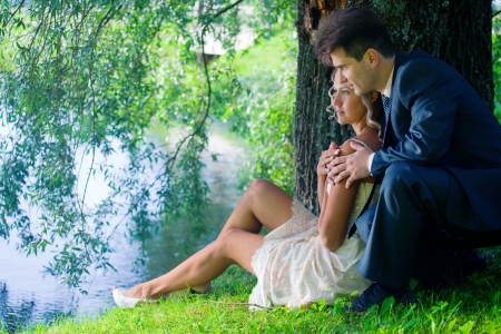 Portrait of newlyweds under a willowの写真素材