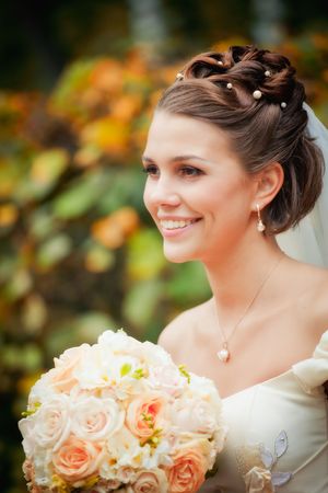 Portrait of newlyweds in autumn parkの写真素材