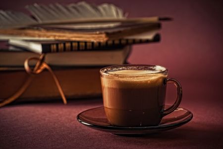 Still life with books and cup of coffeeの写真素材