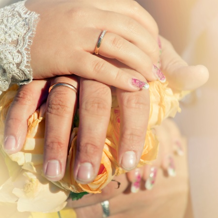 Newlyweds hands with wedding rings.の写真素材