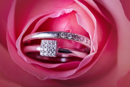 Close-up of pink rose with diamond ringsの写真素材