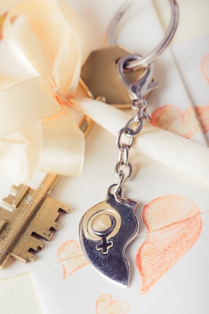 Key with heart pendant and romantic letterの写真素材