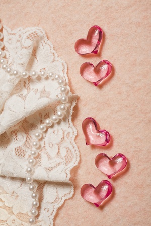 Wedding background with hearts,  lace and pearl beadsの写真素材