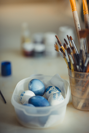 The Easter eggs paintings on white desk at homeの写真素材
