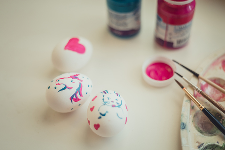 The Easter eggs paintings on white desk at homeの写真素材