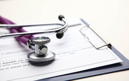 Closeup of a medical stethoscope with folder .の写真素材