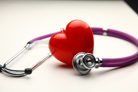 A heart with a stethoscope, isolated on white backgroundの写真素材