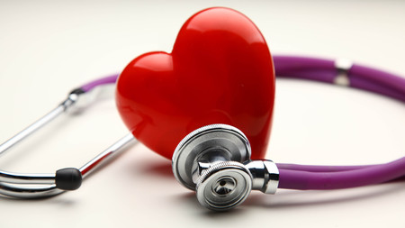 A heart with a stethoscope, isolated on white backgroundの写真素材