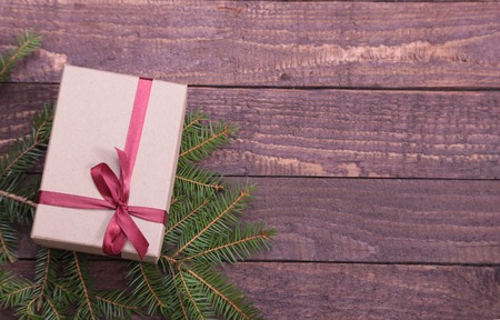 Christmas fir tree with gift boxe on wooden board.の写真素材