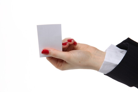 Woman hand giving business card in office.の写真素材
