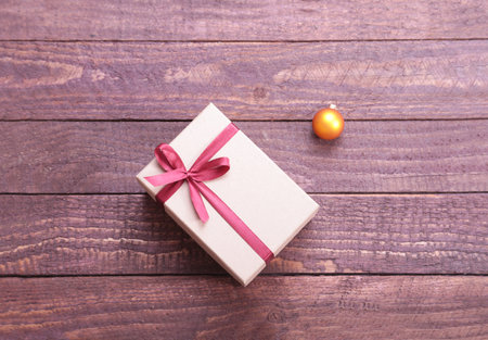 Gift boxes with bow on wood backgroundの写真素材