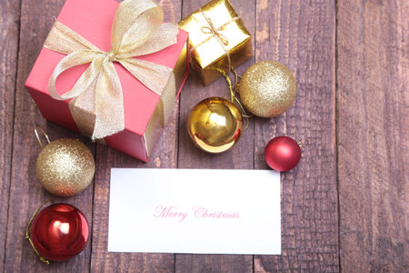 Christmas gift box with red and gold balls