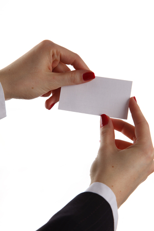 Woman hand giving business card in officeの写真素材