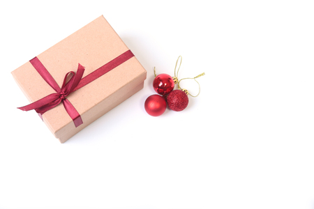 Gift boxes with bow and christmas ball on wood backgroundの写真素材