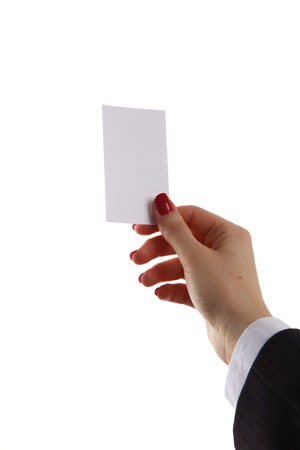 Female hand holding business card in officeの写真素材