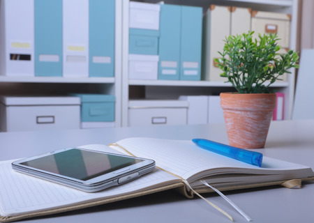 Workplace business still life. blank empty notebook, laptop, tablet pc, mobile phone, penの写真素材