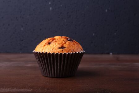Tasty chocolate cupcakes, muffins on a white wooden tableの写真素材