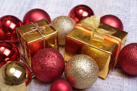 Christmas gift box with christmas red ballsの写真素材