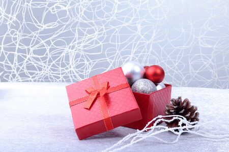 Christmas background with decorations and gift boxes on wooden board.の写真素材