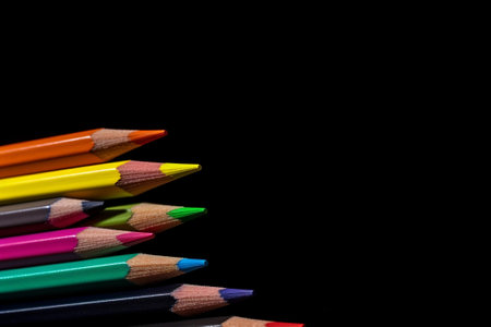 Near of rainbow coloured pencils with duplicate space on dim foundation. Creative resource, AI Generatedの素材