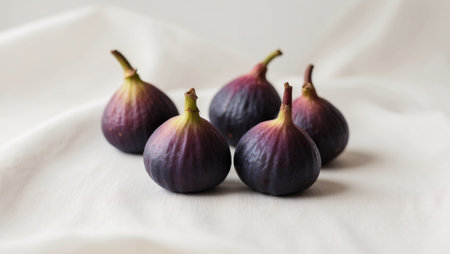 AI Generated. Fresh purple figs arranged on a light backgroundの素材