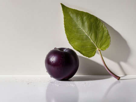 AI Generated. Fresh Purple Plum with Vibrant Green Leafの素材