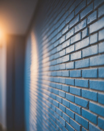 AI Generated. Blue brick wall with a light shining on itの素材