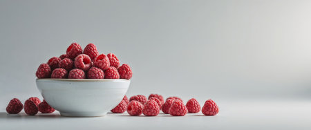 AI Generated. Fresh Raspberries In Bowl On Light Gray Backgroundの素材