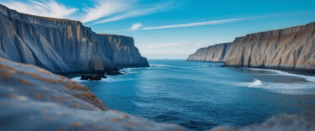 AI Generated. Majestic cliffs frame a serene ocean vista under a clear skyの素材