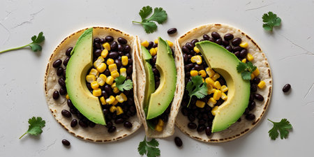 AI Generated. Closeup of Three Delicious Black Bean Tacos with Corn and Avocadoの素材