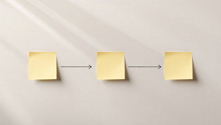 Three yellow sticky notes are displayed against a textured neutral background, connected by black arrows, indicating a sequence or process. The light source is coming from the left, creating shadows.の素材
