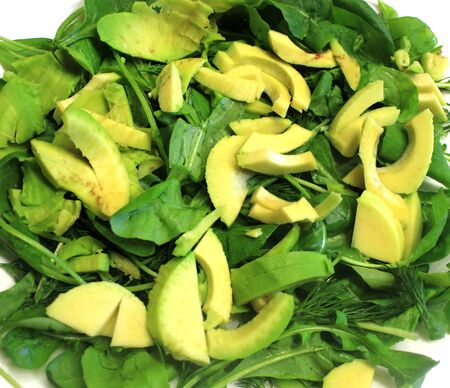 Raw vegan food as background. Salad of greens, avocado arugula spinach, close-up.の写真素材