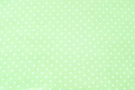 Polka dot fabric background and texture. Wallpaper, card, cover design and decor.の写真素材