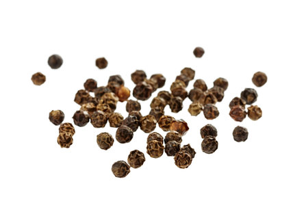 black peppercorns isolated on white backgroundの写真素材