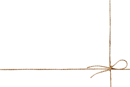 Closeup string or twine tied in a bow isolated on white backgroundの写真素材