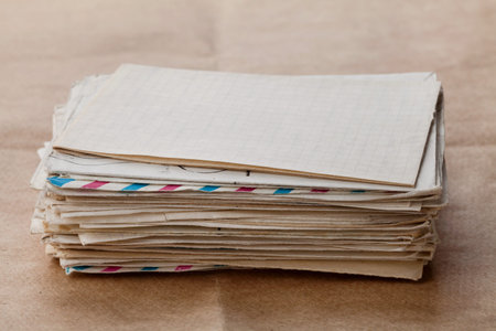 stack of old envelopes and letters on craft paper