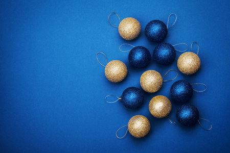 Christmas ball on blue background from above. Flat lay style.の写真素材