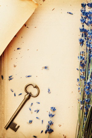 retro still life with vintage paper key and lavender flowers nostalgic composition from aboveの写真素材