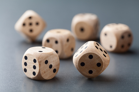 Macro shot of wooden dice. Board game. Gambling devices.の写真素材